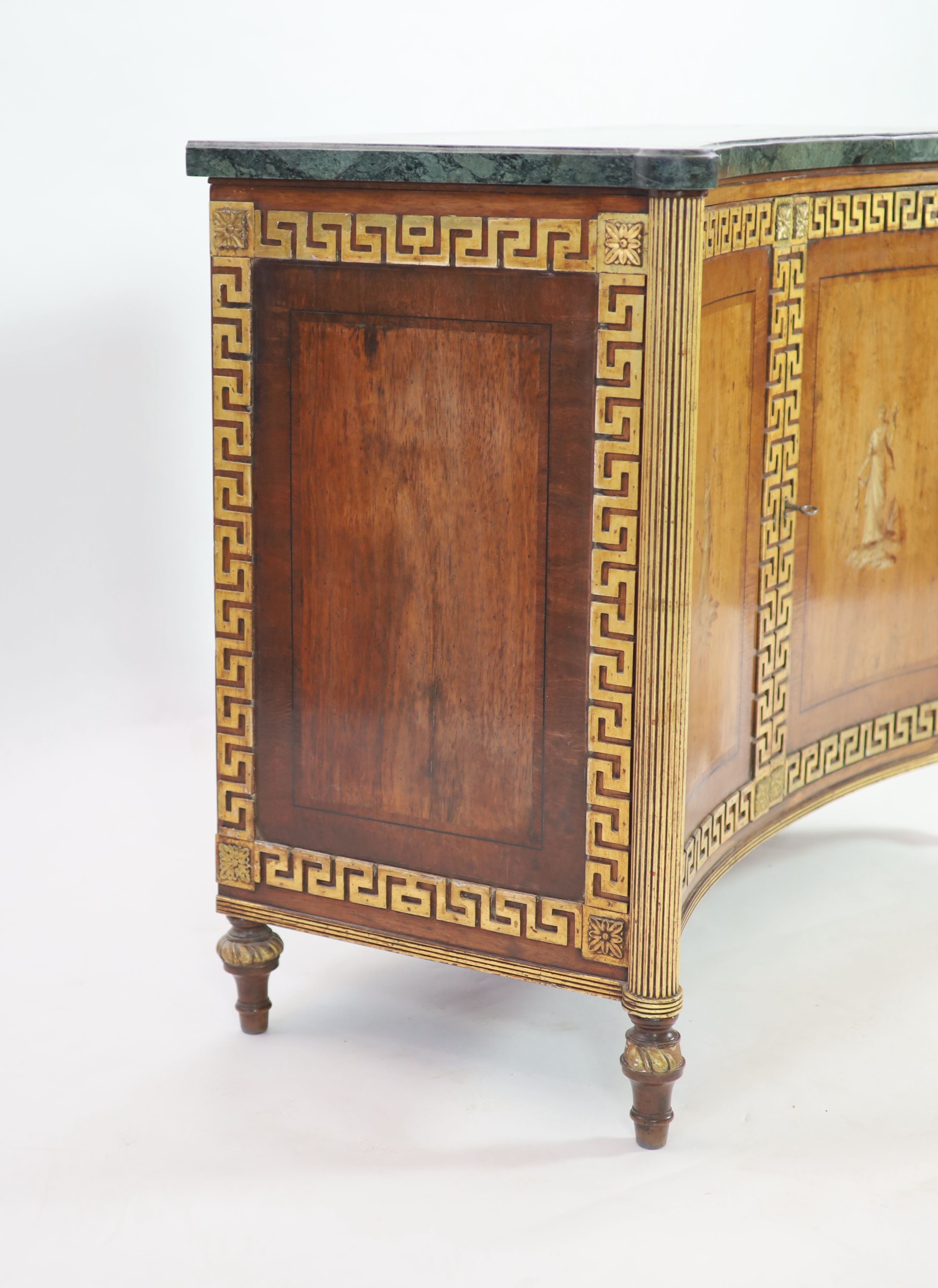 A Regency parcel gilt rosewood concave front side cabinet W.106cm D.52cm H.87cm